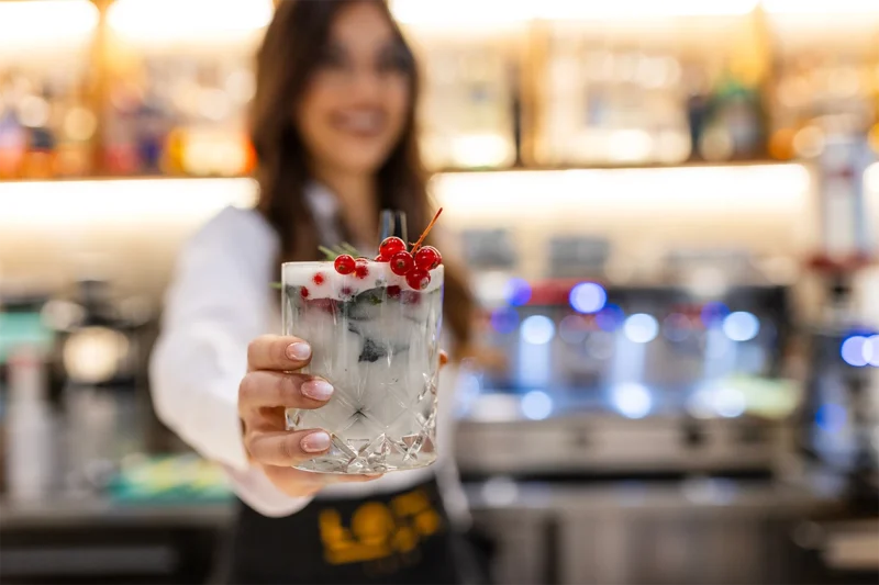 A bartender serving a drink